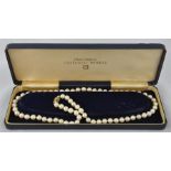 A Mikimoto cultured pearl necklace, having 9ct. gold, jade and pearl set clasp, this stamped "9" and