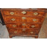 A George 1 walnut and later chest of drawers, with feather banding, the rectangular moulded edge top