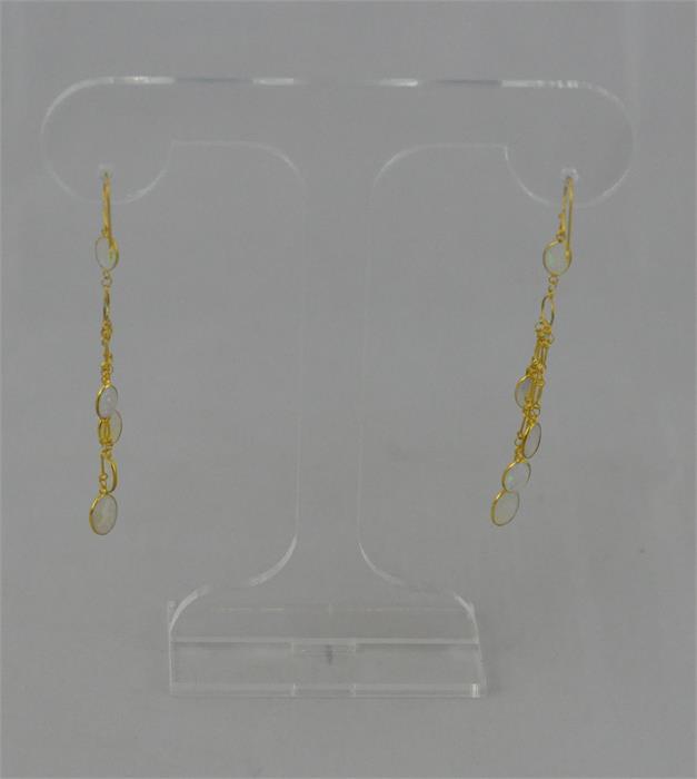 A pair of 14ct. gold and opal drop earrings, each set single oval cabochon opal suspending a further - Image 3 of 4