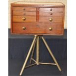 A walnut square dentist cabinet, early 20th century, the ceramic top over and arrangement of