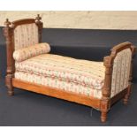 A French Louis XV style walnut miniature dolls bed, with separate mattress and bolster pillow,