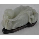 ***REOFFER IN DERBY AUGUST SALE £500/£700***  A Chinese Qing dynasty celadon jade of a seated