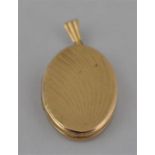 A 9ct. gold locket, of oval form, with raised, curved decoration to front, hallmarked for 9 carat