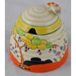 Clarice Cliff for Wilkinson, a Tulips beehive honey pot, Bizarre mark, 9cm high.  CONDITION: spot