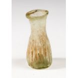 Roman glass ribbed bottle, C. 1st - 3rd Century AD.  A ribbed glass vessel with globular body. Size: