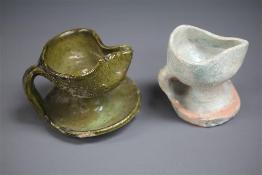 Islamic Oil Lamp Pair, 12th century AD A pair of ceramic oil lamps, both with oval bodies, one end