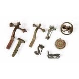 A group of bronze fibulae and brooches including a superb enamelled shield brooch and a horse