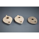 Byzantine Oil Lamp Group, 5th-6th century AD A group of three ceramic oil lamps, two with pale
