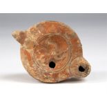 Roman cockerel oil lamp circa 2nd century AD. Here we have a red slip pottery oil lamp decorated