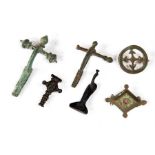 A group of bronze fibulae and brooches including a superb enamelled shield brooch. All varied in