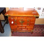 A Chinese elm side cabinet, fitted with two drawers and two doors, made for the export market,