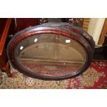 A 19th Century mahogany framed oval mirror and a matching frame (2)