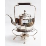 A silver plated teapot with stand