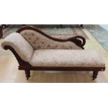 A Victorian mahogany deep buttoned back chaise longue, curving back, floral upholstered,