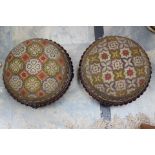 A pair of mahogany wool work embroidered foot stools