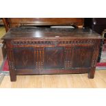 A late 17th / early 18th Century joined oak chest, having a plank top and a three panelled front,