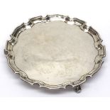 A Scottish silver salver, ogee fluted border on three scroll feet, Glasgow 1935, weight approx 10.