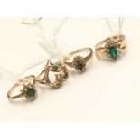 Three various emerald set 14k rings and another (4)