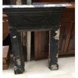 A cast iron fireplace surround