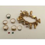 A 9ct charm bracelet with padlock clasp and various 9ct and silver charms;