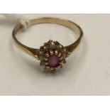 A red and white stone cluster 9ct gold ring