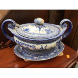 A 19th Century large footed blue and white soup tureen and cover, with matching stand,