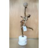 An Art Deco bronze figure of a dancer, holding a marble ball,