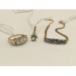 A 14k flat link bracelet set three square cut blue stones to the front;