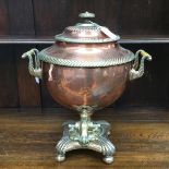 A copper samovar, early 19th Century ivory handles, brass plinth, top,