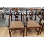 A set of eight Chippendale style mahogany dining chairs,