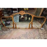 A carved over mantle mirror,