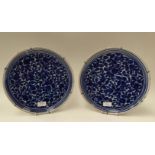 A pair of mid 18th Century Delft blue and white chargers, circa 1755,