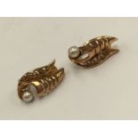 A pair of 9ct gold clip-on earrings set with a cultured pearl, approx 4.