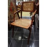 A military 'campaign' folding armchair, re-reeded seat and back,