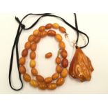 An amber necklace, egg yolk beads, 38.