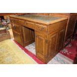 A 20th Century oak double pedestal desk,