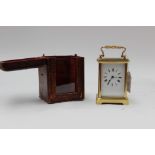 A French brass carriage clock, having white enamel Roman numeral dial with pendulum,