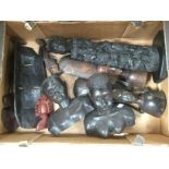 A box containing a large quantity of African ebony carved figures, comprising a pair of busts,