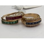 An 18ct gold combination interchangable rings, continental, channel set with sapphire,