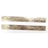 A pair of 20th Century Japanese silver rules, chased with various female figures,