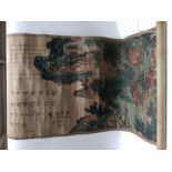 A mid 20th Century Chinese scroll canvas of a colourful mountain scene with a man on horseback on