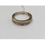 A 9ct gold and diamond half eternity ring, set with ten round brilliant cut channel set stones,