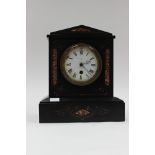 A late Victorian black slate mantle clock,