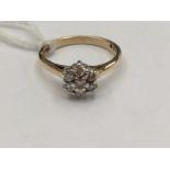 A 9ct gold and diamond cluster ring,flower design, with a total diamond weight 0.