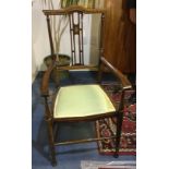 A pair of Edwardian mahogany inlaid open armchairs and a matching side chair (3)