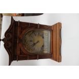 A walnut bracket clock with pierced sides, late 19th Century, Renaissance revival style,