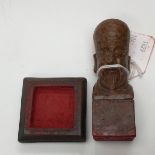 A Chinese hardstone stamp with red stamp base,