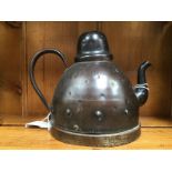 Goberg, a Jugendstil bronzed metal teapot or kettle, domed form with dimpled design,