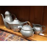 Just Andersen, an Art Deco pewter coffee set, circa 1925, together with a pewter teapot,