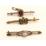 A 9ct green enamel Coronet brooch, a brooch set opal and a garnet and pearl cluster brooch,